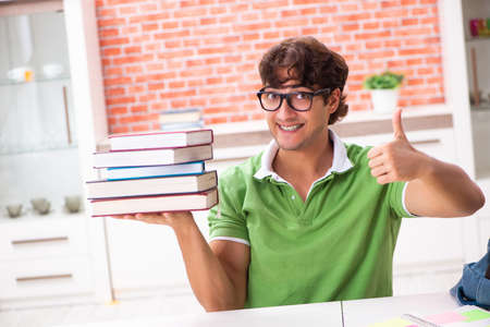 Young student preparing for exams at homeの写真素材