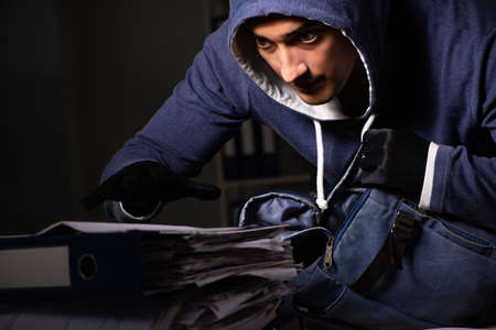 Thief trying to steal personal data in identity theft concept