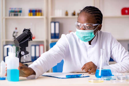 Young black chemist working in the labの写真素材