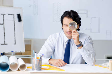 Young handsome architect working on the projectの写真素材
