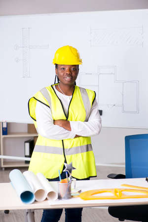 Young black architect working on project