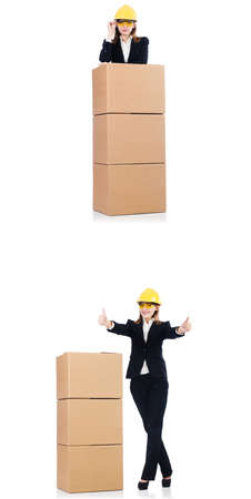 Woman builder with box isolated on whiteの写真素材