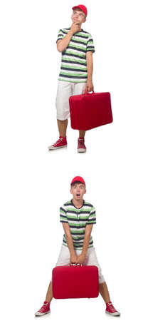 Young man with red suitcase isolated on whiteの写真素材