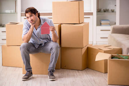 Young man offering home for sale and moving out