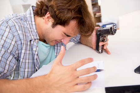 Young man in depression committing suicide