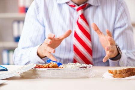Employee eating food with cockroaches crawling aroundの写真素材