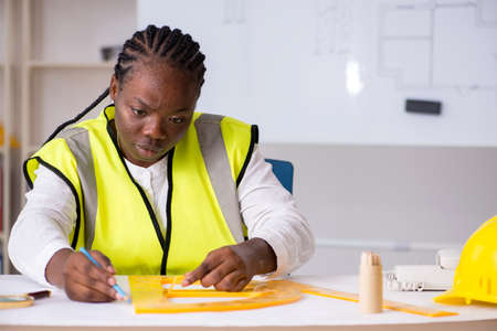 Young black architect working on projectの写真素材