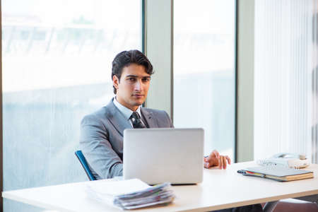 Young successful businessman working at the officeの写真素材