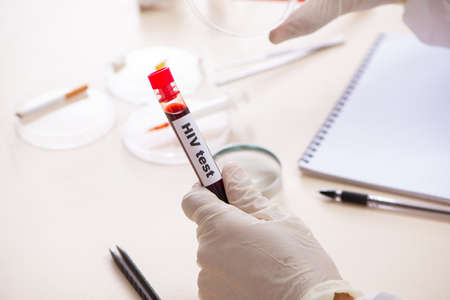 Young expert criminologist working in the labの写真素材