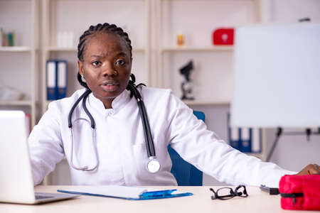 Black female doctor working at clinicの写真素材