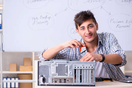 Young it specialist in front of the whiteboard