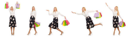 Woman with shopping bags isolated on whiteの写真素材