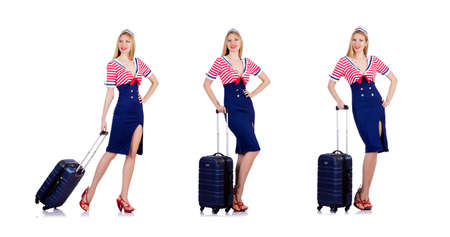 Woman travel attendant with suitcase on whiteの写真素材