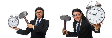 Handsome businessman holding hammer and alarm clock isolated onの写真素材