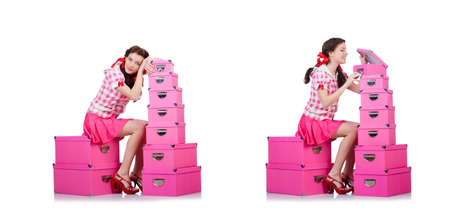 Young woman with storage boxes on whiteの写真素材