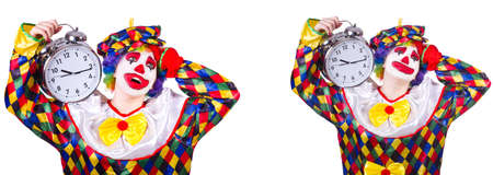 Funny male clown with alarm-clockの写真素材