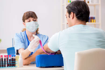 Young patient during blood test sampling procedureの写真素材