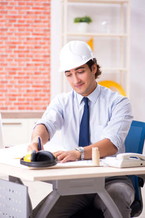 Construction supervisor working on blueprintsの写真素材
