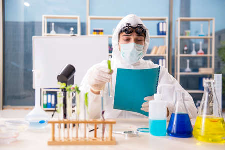Male biotechnology scientist chemist working in the lab