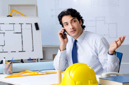 Young handsome architect working on the projectの写真素材