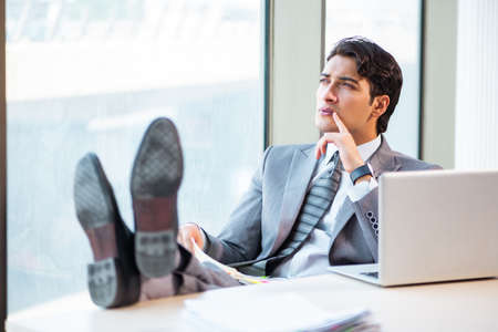 Young successful businessman working at the officeの写真素材