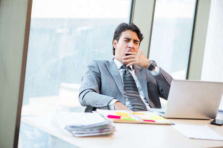 Young successful businessman working at the office