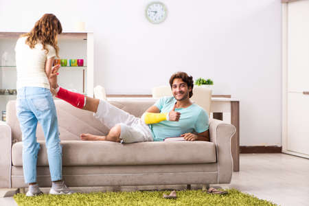 Young family helping each other after injuryの写真素材