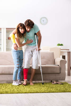 Young family helping each other after injuryの写真素材