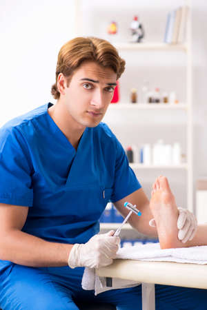 Podiatrist treating feet during procedureの写真素材