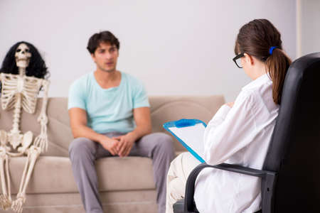 Young patient visiting psychologist for therapyの写真素材