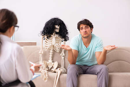 Young patient visiting psychologist for therapyの写真素材