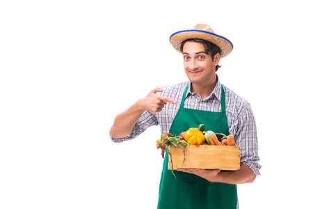 Young farmer with fresh produce isolated on white backgroundの写真素材