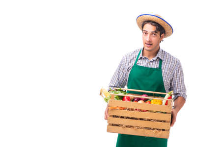 Young farmer with fresh produce isolated on white backgroundの写真素材