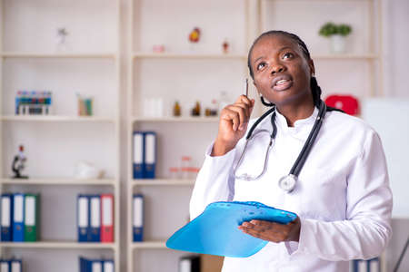 Black female doctor working at clinicの写真素材