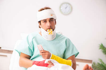 Young injured man staying in the hospitalの写真素材