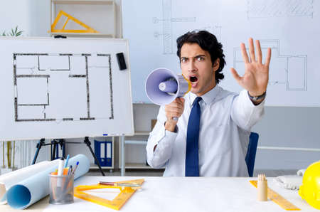 Young handsome architect working on the projectの写真素材