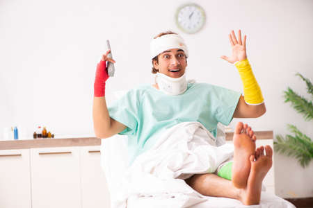 Young injured man staying in the hospitalの写真素材