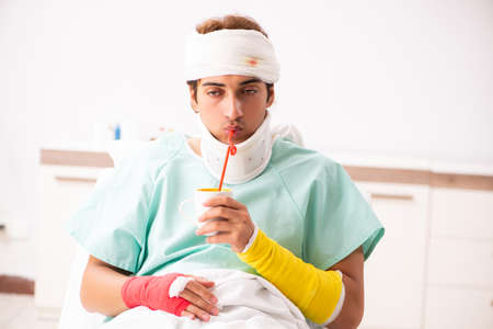 Young injured man staying in the hospitalの写真素材