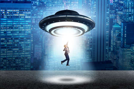 Flying saucer abducting young businessman