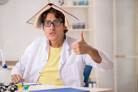 Funny crazy chemist doing experiments and testsの写真素材