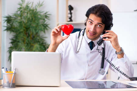Young doctor cardiologist working in the clinicの写真素材