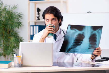 Young handsome doctor radiologist working in the clinicの写真素材