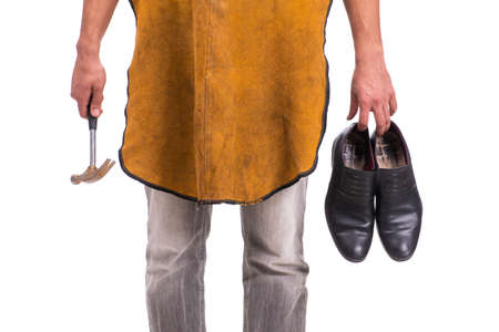 Young handsome shoemaker isolated on whiteの写真素材