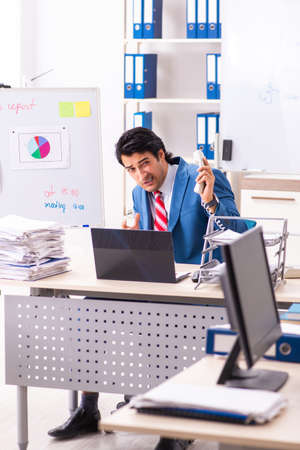 Male sales analyst in front of the whiteboardの写真素材