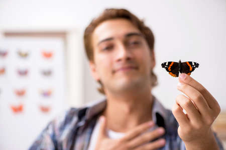 Student entomologist studying new species of butterflies