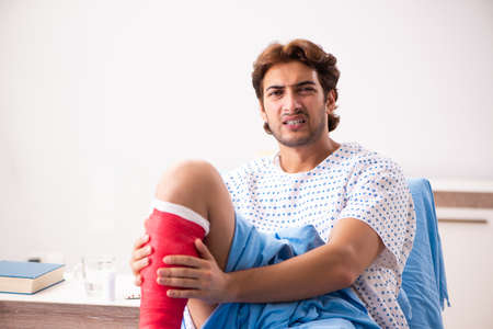 Injured man waiting treatment in the hospitalの写真素材