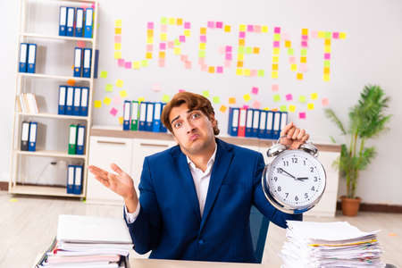 Young employee suffering from excessive work