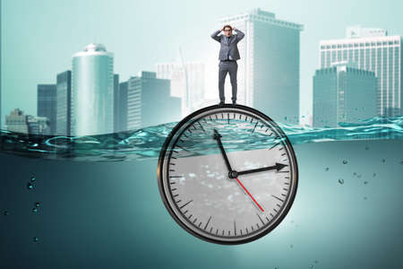 Businessman in deadline and time management concept