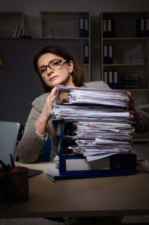 Female employee suffering from excessive workの写真素材