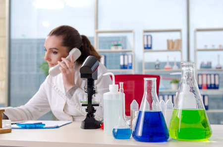 Female biotechnology scientist chemist working in the lab